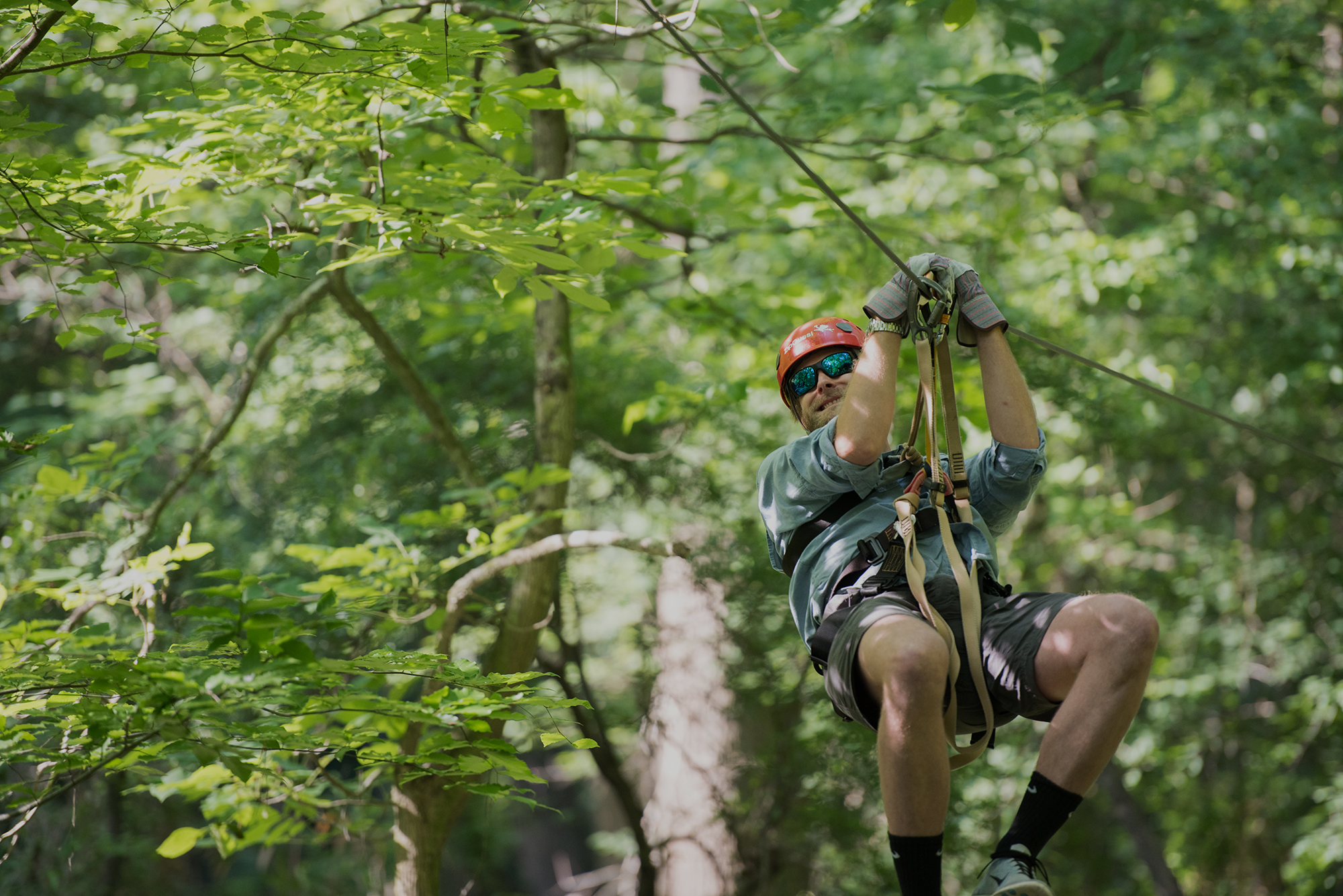 Man Sliding Down Zipline in Fayetteville NC